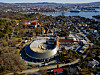 Dronefoto av det nye Vikingtidsmuseet på Bygdøy med Oslofjorden og byen i bakgrunnen.