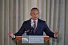 Nickolay Mladenov stands behind an FPA lectern, speaking with arms raised during a press briefing.