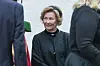 Dronning Sonja i mørk bekledning under en gravferd ved Ris kirke i Oslo.